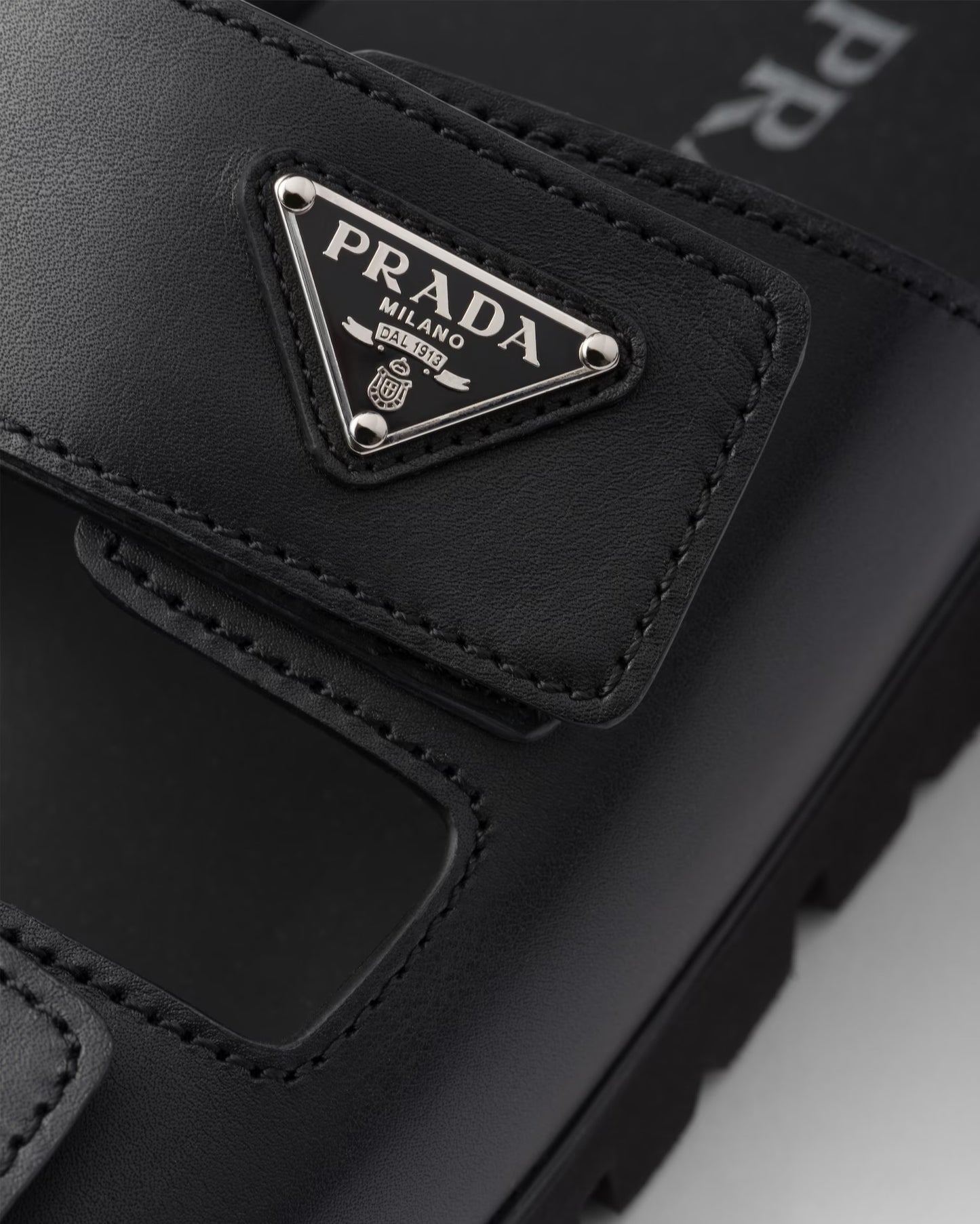 PRADA
Black Leather Slides