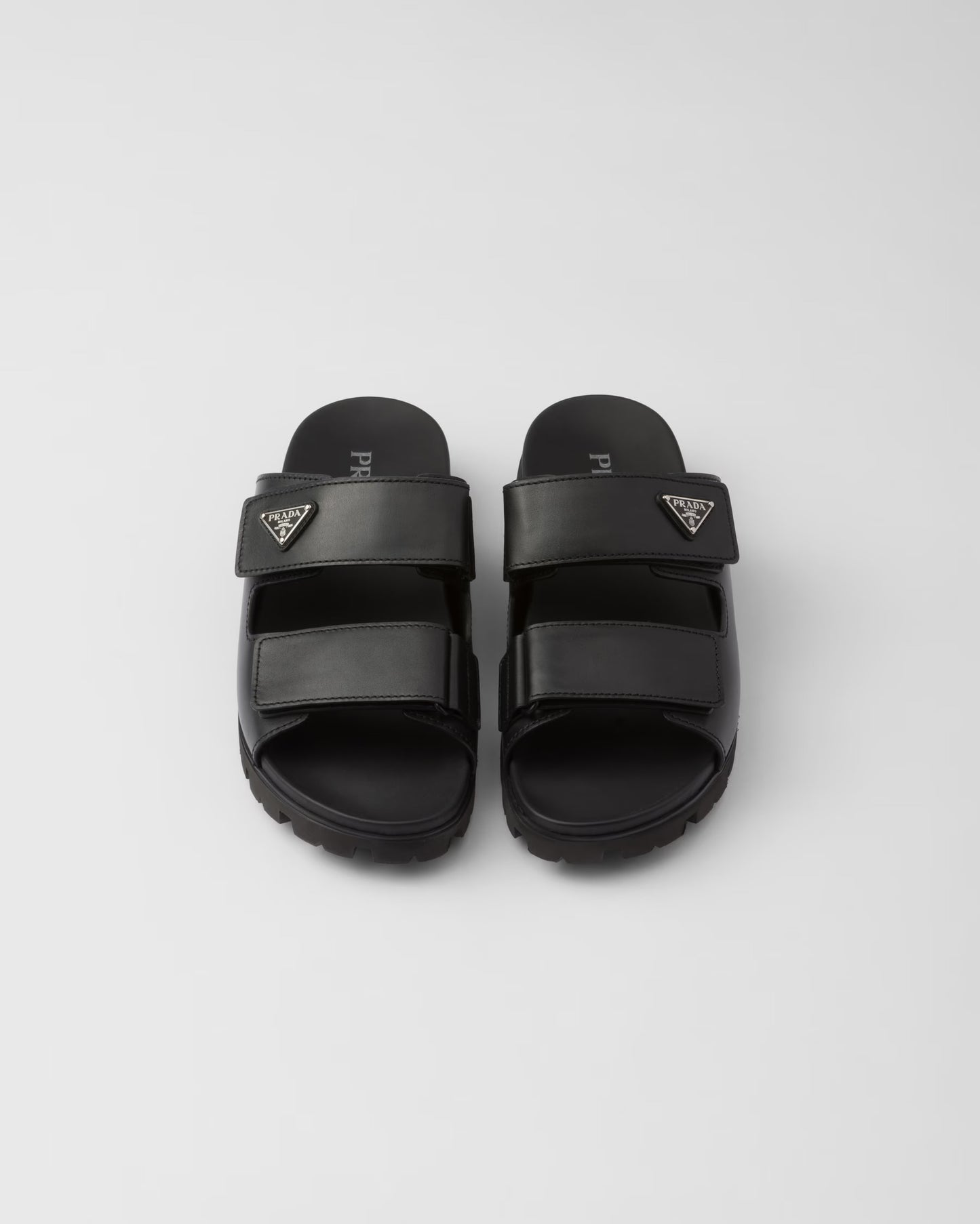 PRADA
Black Leather Slides