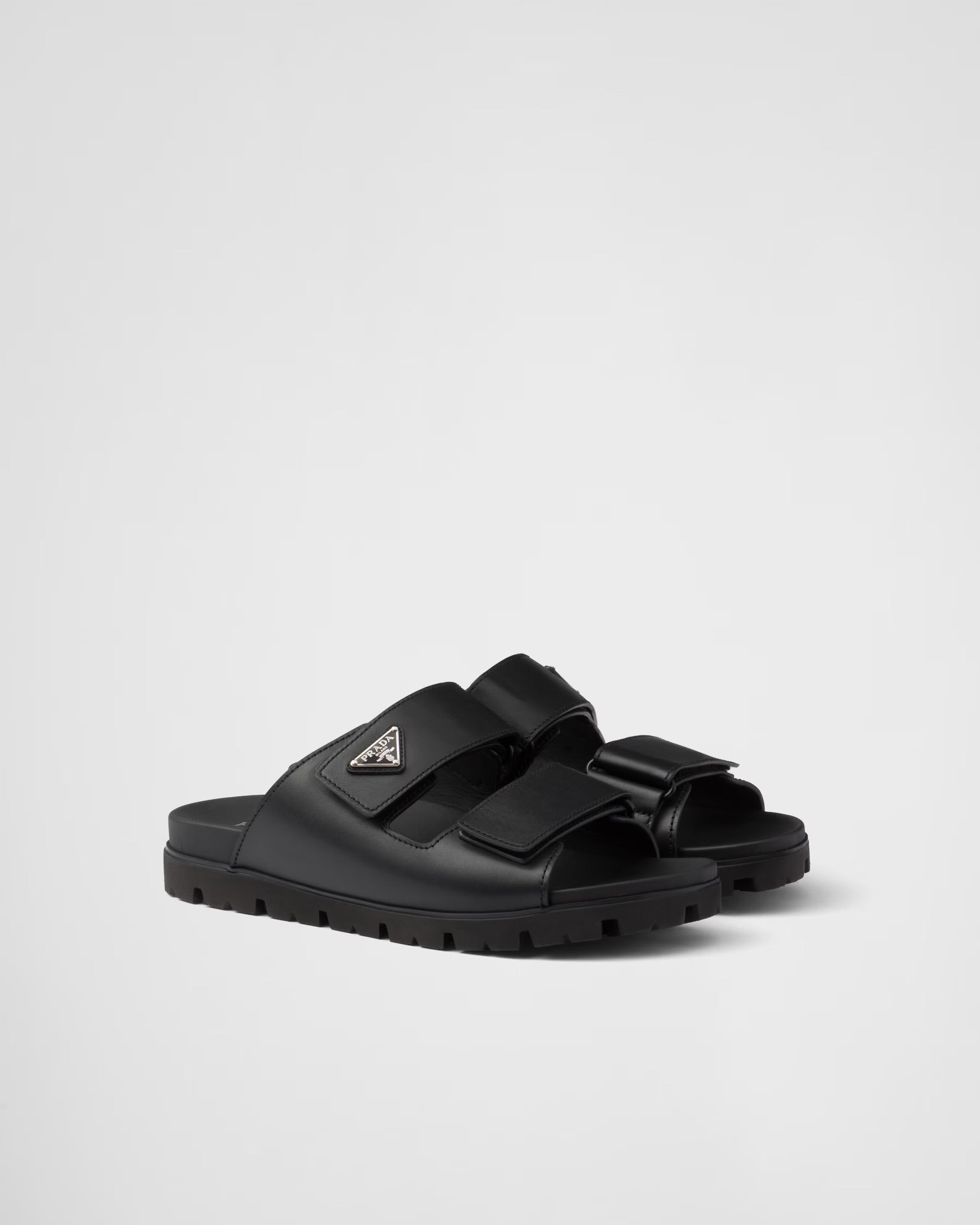 PRADA
Black Leather Slides