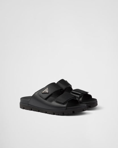 PRADA
Black Leather Slides