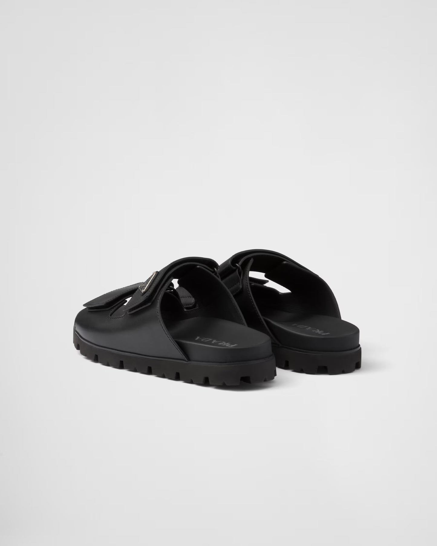 PRADA
Black Leather Slides